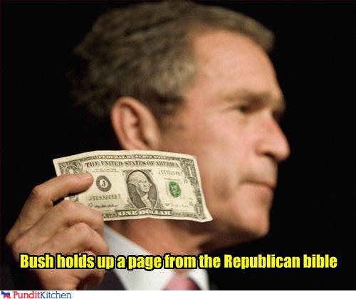 political pictures - Bush holds up a page from the Republican bible