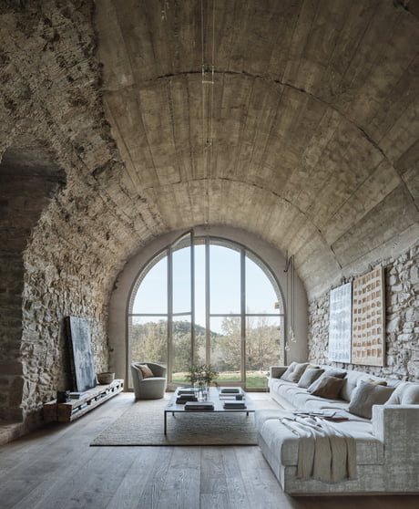 Living Area Features A Tall Barrel Vaulted Ceiling And Original